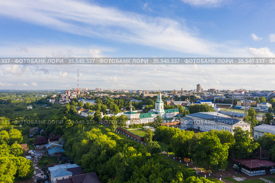 Kirov and the high bank of the river Vyatka and the Alexander Grin Embankment and Trifonov Monastery on a sunny summer day. Редакционное фото, фотограф Mikhail Starodubov / Фотобанк Лори