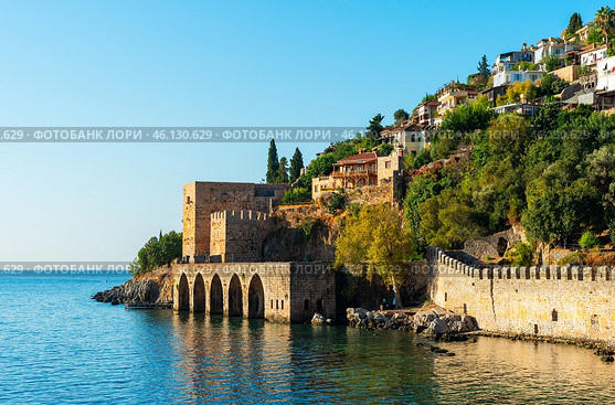 Landscape of an ancient shipyard near the Kyzyl Kule tower in Alanya, Antalya region, Turkey at sunrise (2021 год). Редакционное фото, фотограф Светлана Султанаева / Фотобанк Лори