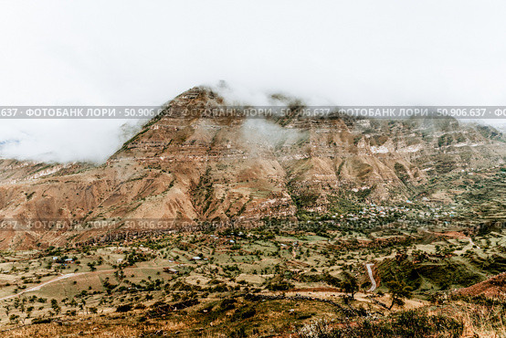 Landscape of Dagestan mountains, mountain range in haze summer Russia. Стоковое фото, фотограф Spirit River / Фотобанк Лори