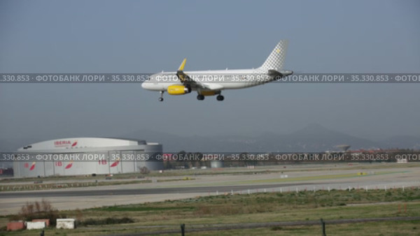 Large passenger airliner of Vueling Airlines with EC-MXP registration number landing in International El Prat Airport in Barcelona (2020 год). Редакционное видео, видеограф Яков Филимонов / Фотобанк Лори