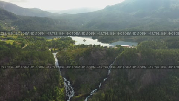 Latefossen is one of the most visited waterfalls in Norway and is located near Skare and Odda in the region Hordaland, Norway. Consists of two separate streams flowing down from the lake Lotevatnet. (2019 год). Стоковое видео, видеограф Андрей Армягов / Фотобанк Лори