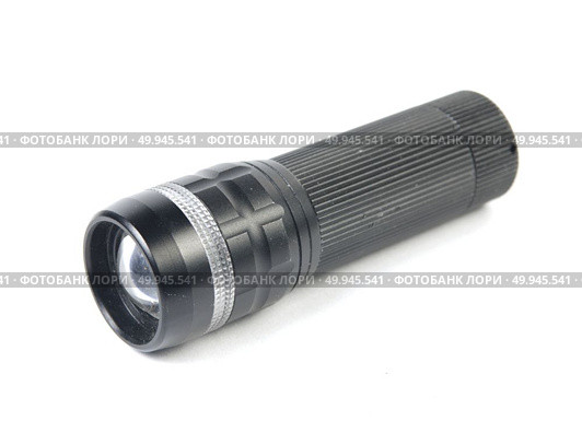 LED flashlight switched on, isolated on white. Стоковое фото, агентство Ingram Publishing / Фотобанк Лори