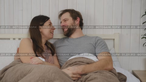 Loving mature couple interactions at home. Man and woman embracing, hugging, holding hands and dancing. Wife with husband intimate moments. couple is touching, cuddling, kissing. Natural lighting. 4K. Стоковое видео, видеограф Марина Демидюк / Фотобанк Лори