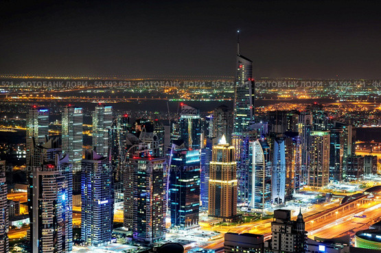 Majestic colorful dubai marina skyline during night. Multiple tallest skyscrapers of the world. Dubai marina, United Arab Emirates. Стоковое фото, агентство Ingram Publishing / Фотобанк Лори