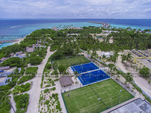 Maldives paradise scenery. Tropical aerial landscape, seascape with long jetty, water villas with amazing sea and lagoon beach, tropical nature. Exotic tourism destination banner, summer vacation. Стоковое фото, агентство Ingram Publishing / Фотобанк Лори