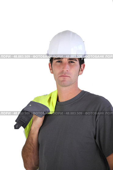 Man carrying reflective jacket over shoulder. Стоковое фото, агентство Ingram Publishing / Фотобанк Лори