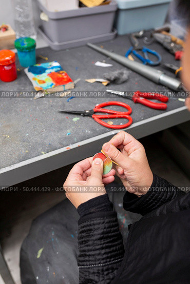 man handcrafting piece colorful wood. Стоковое фото, агентство Ingram Publishing / Фотобанк Лори