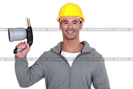 Man holding blowtorch. Стоковое фото, агентство Ingram Publishing / Фотобанк Лори