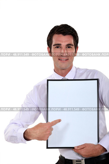 Man holding up a blank bulletin board. Стоковое фото, агентство Ingram Publishing / Фотобанк Лори