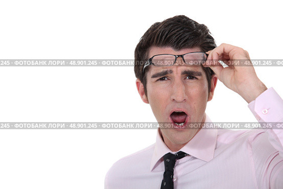 Man taking his glasses off. Стоковое фото, агентство Ingram Publishing / Фотобанк Лори