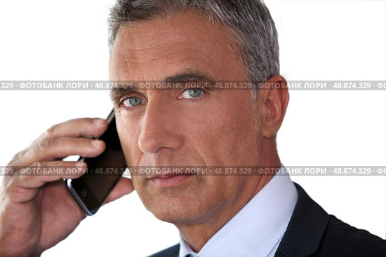 Man talking on his mobile phone. Стоковое фото, агентство Ingram Publishing / Фотобанк Лори