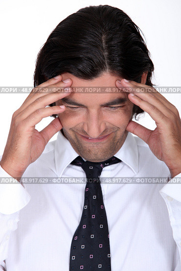 Man with a headache. Стоковое фото, агентство Ingram Publishing / Фотобанк Лори