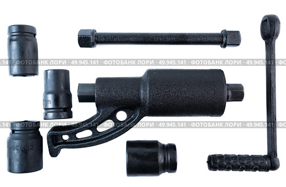 Manual torque multiplier wrench set with sockets and handle on white background, ideal for loosening tight lug nuts on trucks or heavy vehicles. Стоковое фото, фотограф Татьяна Терехина / Фотобанк Лори