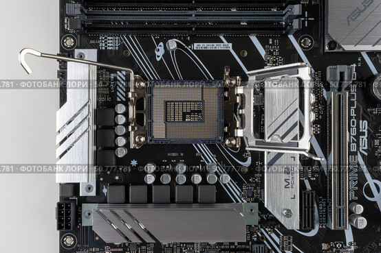 Maykop, Russia - February 18, 2025: socket for Intel processors on the ASUS motherboard close-up top view. Редакционное фото, фотограф Андрей С / Фотобанк Лори