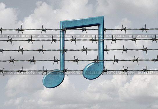 Media censorship concept and music restriction symbol as a musical note on a barb or barbed wire fence element as a metaphor for parental control or banning art or protecting digital rights to audio content control. Стоковое фото, агентство Ingram Publishing / Фотобанк Лори