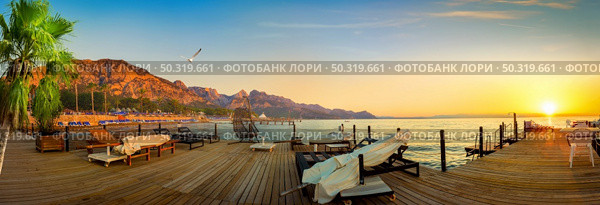 Mediterranean sea and mountains in turkish Kemer. Pier on the beach. Стоковое фото, агентство Ingram Publishing / Фотобанк Лори