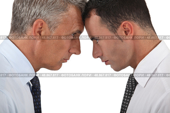 Men head butting. Стоковое фото, агентство Ingram Publishing / Фотобанк Лори