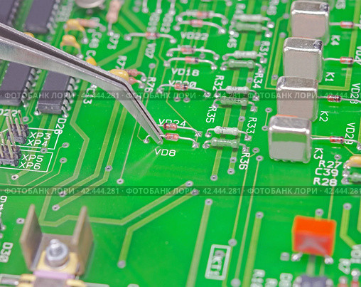 Микросхемы на печатной плате прибора. Circuit board macro as background. Стоковое фото, фотограф Татьяна Д / Фотобанк Лори