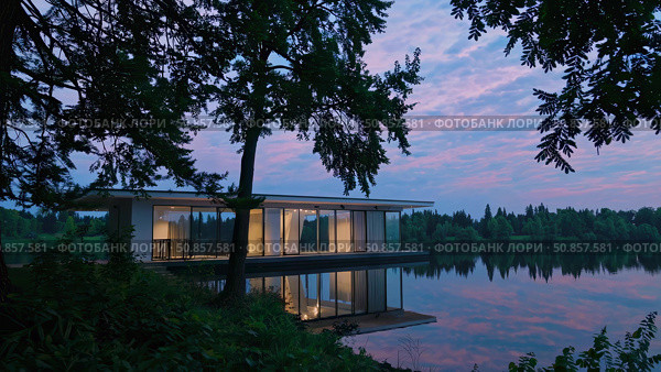 Minimalist floating home hovering above tranquil lake waters, glass walls mirroring golden sunset light amid dense green shoreline vegetation. Стоковое AI-изображение, AI-художник Данил Руденко / Фотобанк Лори
