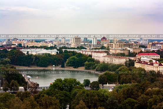 Minsk cityscape with Svislach river and General Staff of the Republic of Belarus in the distance. Aerial view on the center of Minsk, Belarus. City park surrounded by residential buildings. Стоковое фото, фотограф Константин Григорьев / Фотобанк Лори