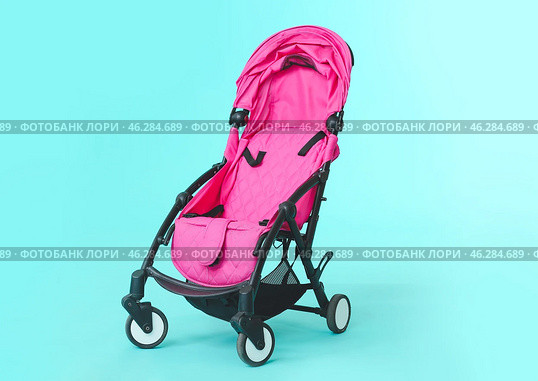 Modern baby stroller on color background. Стоковое фото, фотограф Pixel_shot / Фотобанк Лори