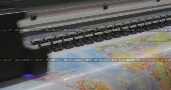 Modern Digital Large format UV printer. Printing production technologies. UV pinning is the process of applying a dose of low intensity ultraviolet light to a UV curable ink. Стоковое видео, видеограф Андрей Армягов / Фотобанк Лори