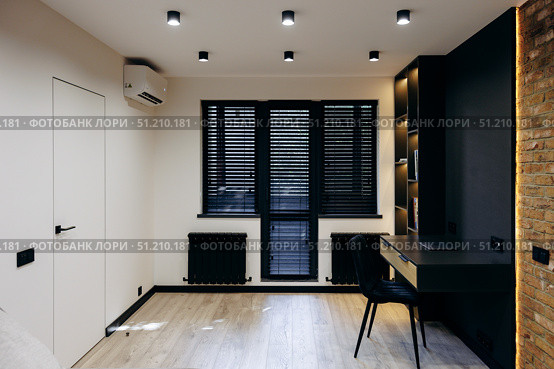 Modern Minimalist Home Office Design Featuring a Beautiful Desk and Chic, Stylish Decor Accents. Стоковое фото, фотограф Cantemir Dumitru / Фотобанк Лори