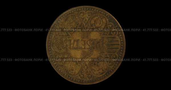 Монета Испании 1 песета 1944, черный фон. Reverse of Spain coin 1 peseta 1944, isolated in black background. Close up view. Стоковая анимация, аниматор Александр Кузнецов / Фотобанк Лори