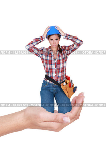 Montage of young female laborer  crouching in a hand. Стоковое фото, агентство Ingram Publishing / Фотобанк Лори