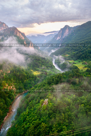 Montenegro, panorama mountains and of sunset sky . Canyon near city Zabljak . Стоковое фото, агентство Ingram Publishing / Фотобанк Лори