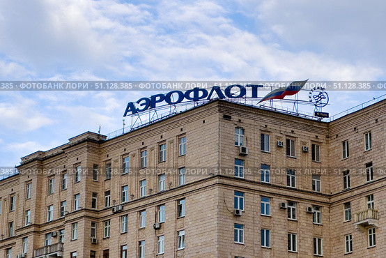 Moscow, Russia - Aeroflot logo on their headquarters on Poklonnaya Gora in Moscow on blue sky background with copy space. Aeroflot is the biggest Russian air carrier. Редакционное фото, фотограф Ирина Михайличенко / Фотобанк Лори