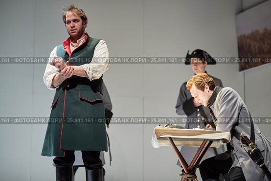 MOSCOW, RUSSIA - JAN 15, 2015: Actors K.Loskutov and S.Davydov as prisoner Rozhnov and Pretender on stage of Moscow theatre Et Cetera in play Boris Godunov directed by Peter Stein. Редакционное фото, фотограф Losevsky Pavel / Фотобанк Лори