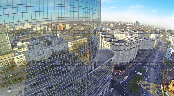 MOSCOW, RUSSIA - NOV 09, 2013: (view from unmanned quadrocopter) Roof of Business Centre Preo-8 and Preobrajenskaya Square. Height of twenty-eight-storey building Preo-8 is 106 m. Редакционное фото, фотограф Losevsky Pavel / Фотобанк Лори