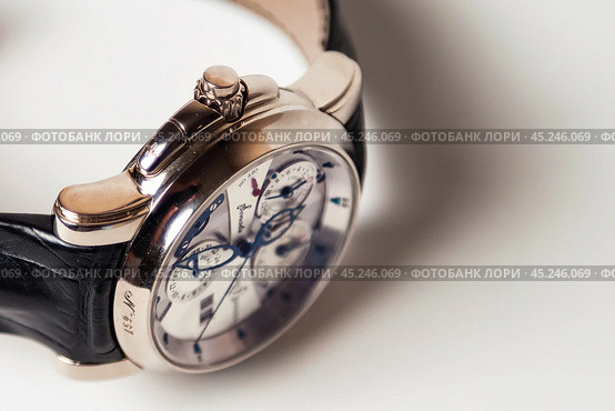 Munich, Swiss - 24 oct 2024: swiss wrist watch Ulysse Nardin SONATA Cathedral, close-up 3d. Silver wristband and bright steel dial, tachymeter, chronograph. Luxury watches concept. Copy ad text space. Редакционное фото, фотограф Aleksandr Golubev / Фотобанк Лори
