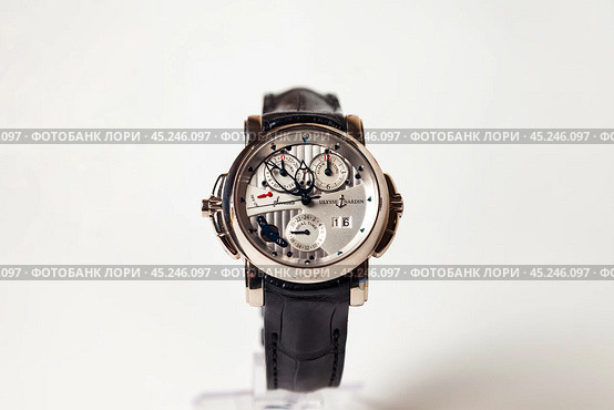 Munich, Swiss - 24 oct 2024: swiss wrist watch Ulysse Nardin SONATA Cathedral, close-up 3d. Silver wristband and bright steel dial, tachymeter, chronograph. Luxury watches concept. Copy ad text space. Редакционное фото, фотограф Aleksandr Golubev / Фотобанк Лори