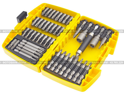 Набор сменных насадок, бит, для отверток на белом фоне. A variety of replaceable nozzles for screwdriver bits on a white background. Стоковое фото, фотограф Татьяна Д / Фотобанк Лори