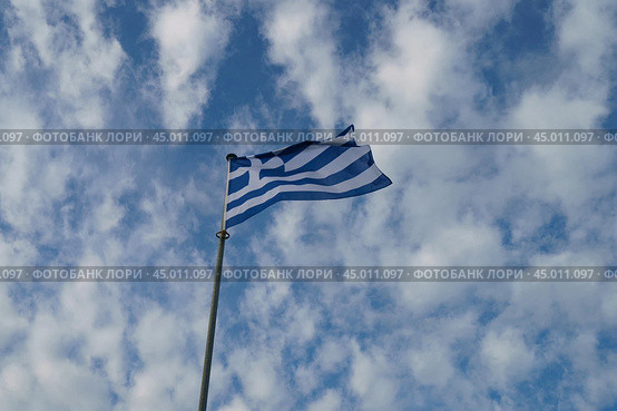 National flag of  Greece (blue and white). Flags blowing on the wind in a sunny summer day. Flags against blue sky background. (2019 год). Стоковое фото, фотограф YuryKara / Фотобанк Лори