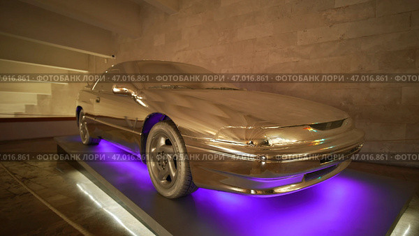 Neon illumination from bottom of car and gold painting. Стоковое фото, фотограф David Kashakhi / Фотобанк Лори