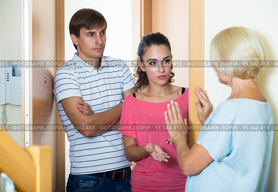 Nervous neighbors coming to old lady with complains. Стоковое фото, фотограф Яков Филимонов / Фотобанк Лори