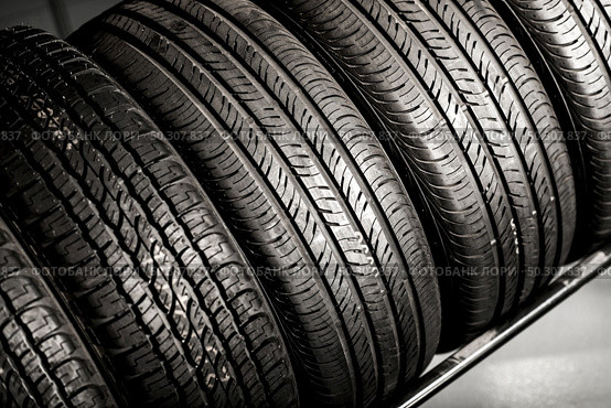New Compact Vehicles Tires Stack. Winter and Summer Season Tires. Стоковое фото, агентство Ingram Publishing / Фотобанк Лори