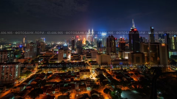 Nighttime timelapse of the Malaysian capital Kuala Lumpur. Стоковое видео, видеограф Mikhail Davidovich / Фотобанк Лори
