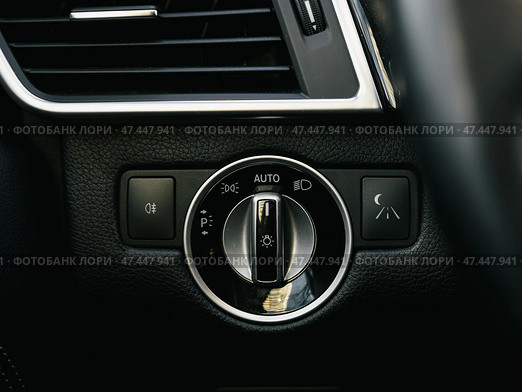 Novosibirsk, Russia -  March  23, 2024: Mercedes-Benz GL-class,  close-up of headlight  buttons. modern car interior. Стоковое фото, фотограф Виталий Сова / Фотобанк Лори