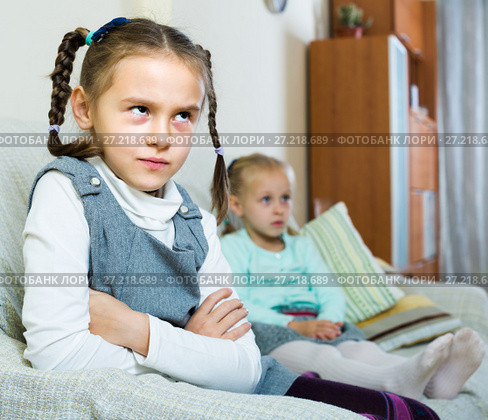 Offended girls sitting apart at home. Стоковое фото, фотограф Яков Филимонов / Фотобанк Лори