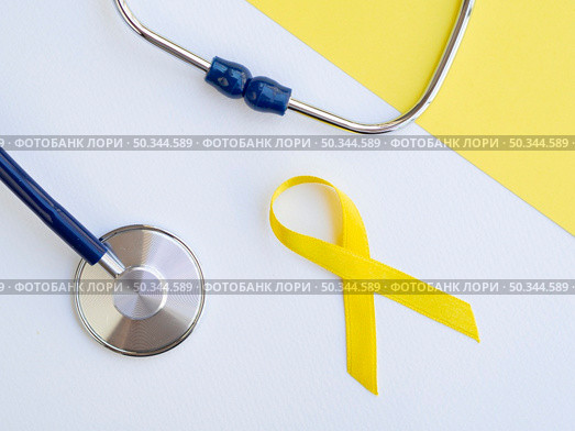 OLYMPUS DIGITAL CAMERA. high angle arrangement with children cancer ribbon. Стоковое фото, агентство Ingram Publishing / Фотобанк Лори