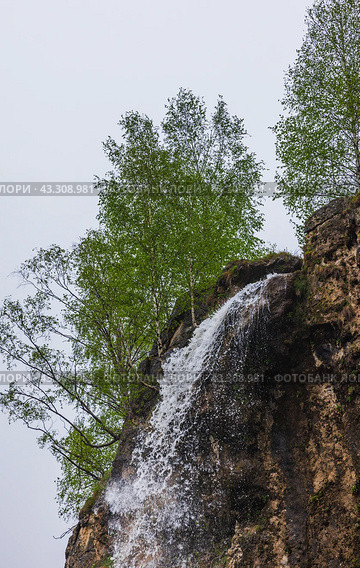 One of the Honey waterfalls is under bright sky on a summer day. Стоковое фото, фотограф EugeneSergeev / Фотобанк Лори