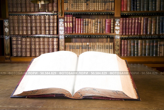 Open book in old library. Part of series. Стоковое фото, агентство Ingram Publishing / Фотобанк Лори