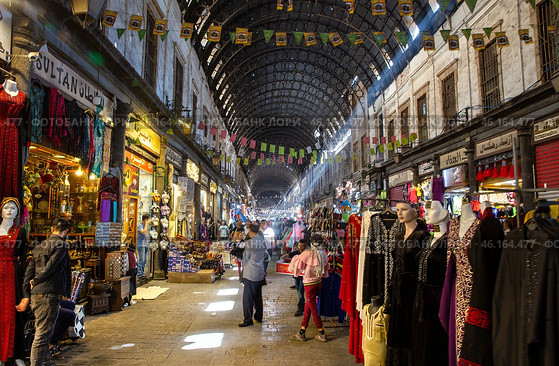 Ordinary day in Al-Hamidiyah Souq in the old city of Damascus. Bazaar is the largest souk in Syria. Souq starts at Al-Thawra street and ends at Umayyad Mosque. Редакционное фото, фотограф Евгений Ткачёв / Фотобанк Лори