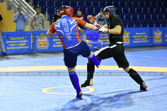 Orenburg, Russia - October 5, 2019: Men compete in Pankration wrestling. Редакционное фото, фотограф Владимир Галкин / Фотобанк Лори