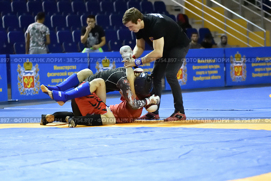 Orenburg, Russia - October 5, 2019: Men compete in Pankration wrestling. Редакционное фото, фотограф Владимир Галкин / Фотобанк Лори