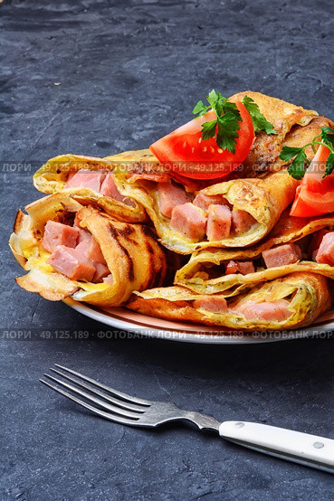 Pancakes for Shrove Tuesday. Tasty pancakes stuffed with meat and mushrooms on the plate. Стоковое фото, агентство Ingram Publishing / Фотобанк Лори